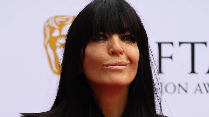 Claudia Winkleman, host of The Celebrity Traitors, smiling on the BAFTA TV Awards red carpet