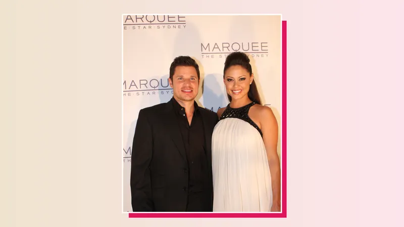 Love Is Blind hosts Nick and Vanessa Lachey smiling on a red carpet