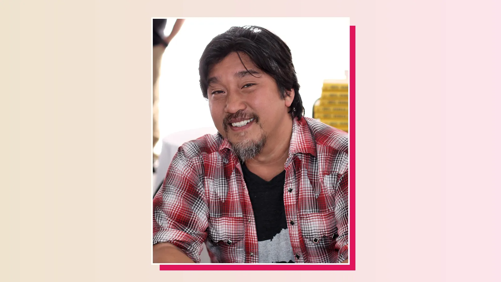 Chef Edward Lee, Culinary Class Wars Season 1 runner-up, smiling in a red plaid shirt at a book signing